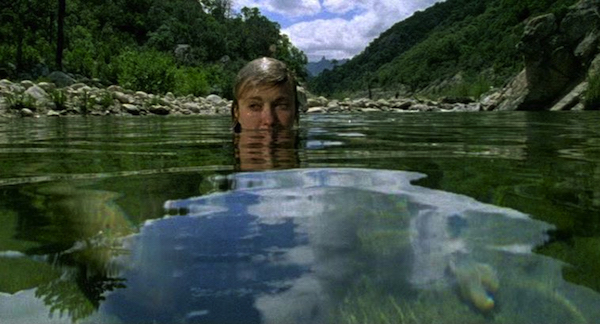 Dancers emerge from the water, giving importance to its surface; screenshot from Blush.